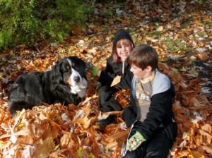 Molly & grandkids playing in leaves